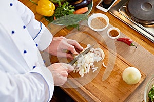 Chef Cutting Onion