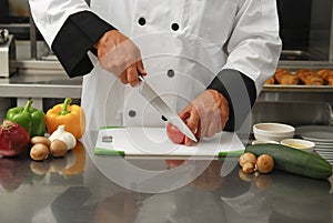 Chef cutting vegetables photo