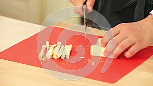 Chef Cutting White Bread into Pieces to Cook