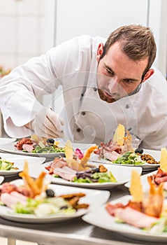 Chef decorating appetizer plate