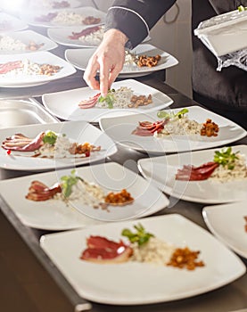 Chef decorating appetizer plate