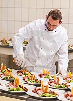Chef decorating appetizer plate