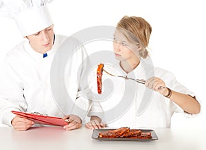 Chef examining cook