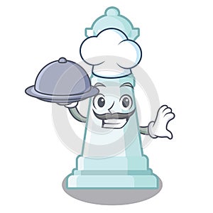 Chef with food chess queen in the cartoon shape photo