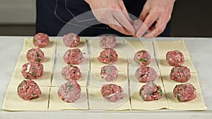 the chef forms balls of minced meat and puts on the dough. Cooking stuffed pies at home