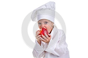 Chef girl in a cap cook uniform, biting the red apple. Human emotions, facial expression feeling, attitude. Landscape