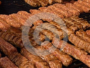 Chef grilling meat during cookout picnic or food event. Meat mix variety, Labour Day, 1 Mai