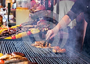 Chef is grilling perfect steak on cast iron grate