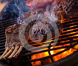 Chef grilling ribs in a restaurant photo