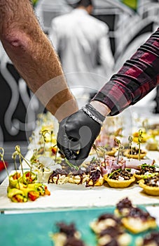 Chef hand in process of Preparing catering food