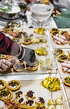 Chef hand in process of Preparing catering food