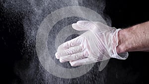 Chef Hands Clapping With Flour In Slow Motion on black background. Frame. Chef Claps Hands Together With Flour, Super