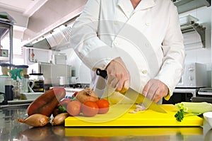 Chef hands cutting vegetables