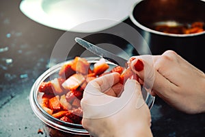 Chef hands slicing fresh strawberries. Bowl with strawberries. Strawberries recipe. Kitchen