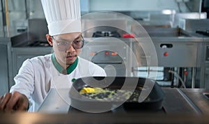 The chef has to control the heat of the stove just right to grill the steak so that the ripeness of the meat is according