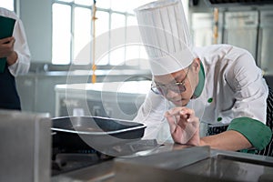 The chef has to control the heat of the stove just right to grill the steak so that the ripeness of the meat is according to the