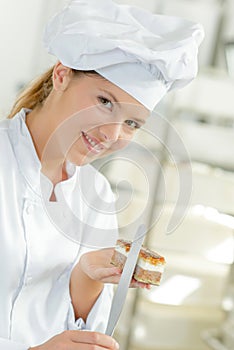 Chef holding cake and palette knife