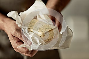 Chef holding a pat of farm fresh herb butter