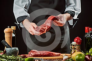 Chef holding a piece of beef meat