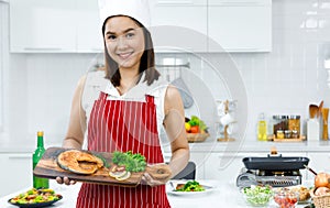 Chef holding salmon steak.