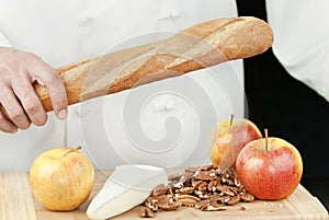 Chef Holds Baguette, Close
