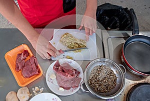 Chef in hotel or restaurant kitchen cooking only hands