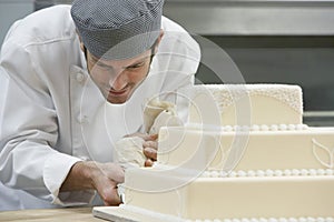 Chef Icing Wedding Cake