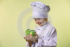 Chef keeps in his hands a cabbage