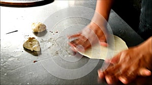 Chef Kneading Roti Dough in the Kitchen