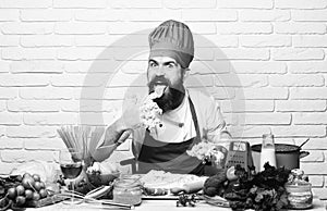 Chef kneads dough. Cook with excited face in burgundy uniform