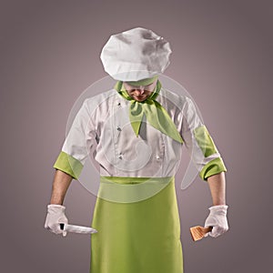Chef with knife and kitchen spatula