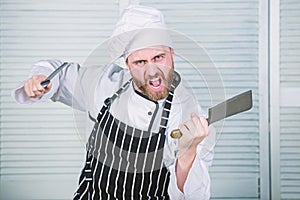 Chef with knifes. Professional in kitchen. culinary cuisine. angry bearded man with knife. love eating food. confident