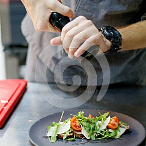 Chef makes beetroot salad.