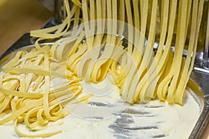 The chef makes fresh spaghetti from scratch
