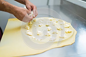 Chef making Cheese Focaccia from Recco Italy