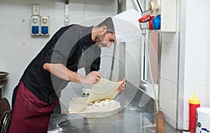 Chef making Cheese Focaccia from Recco Italy