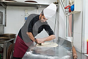 Chef making Cheese Focaccia from Recco Italy