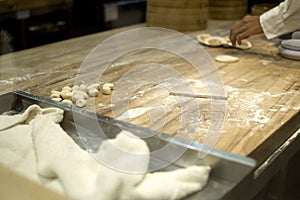 A chef is making a chinese dumplings