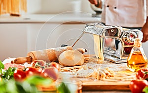 Chef making homemade pasta in a pizzeria photo