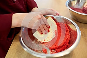 Chef making macaron batter at confectionery