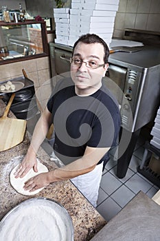 Chef making a pizza