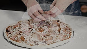 Chef making a pizza in modern italian restaurant