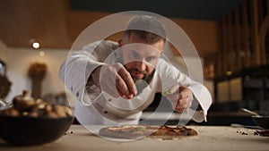 Chef making vegetarian pizza in restaurant kitchen. Italian food tasty concept.