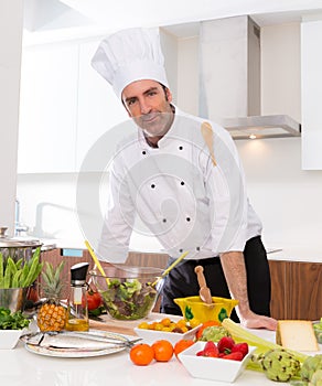 Chef male portrait on white countertop at kitchen