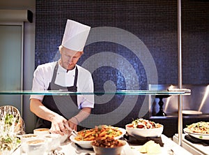 Chef, man and food in kitchen of restaurant for catering industry for meal with hospitality or fine dining with