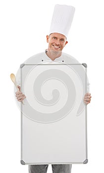 Chef man, space and board isolated on a white background of empty menu and happy culinary services. Professional