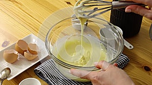 Chef mixing batter with whisk
