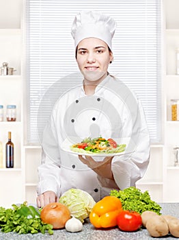 Chef offering vegetarian meal