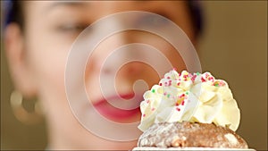 Chef Ornamenting Muffin with Whipped Cream and Strawberry