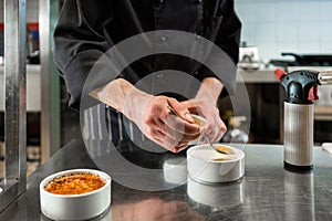 Chef or patissier preparing dessert photo